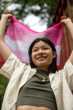 Happy young person with pride flag