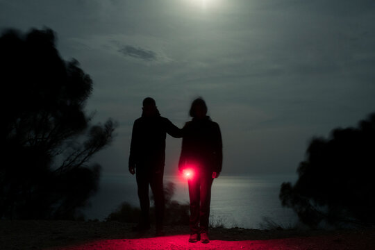 Mysterious Couple Silhouettes With Red Light At Night