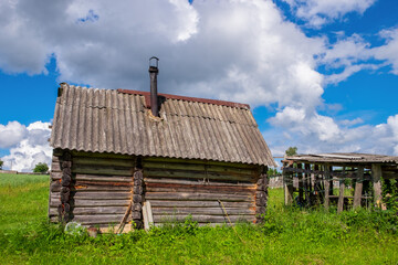 An old rickety wooden bathhouse in the heartland of Russia - obrazy, fototapety, plakaty