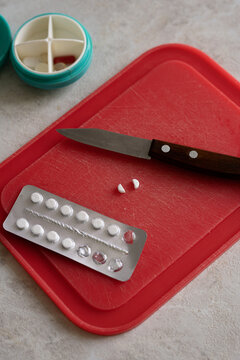 Pills on a cutting plate
