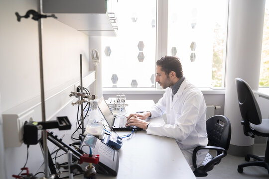 Man Using Laptop In Lab