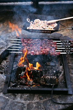 Cooking outdoors on open fire.