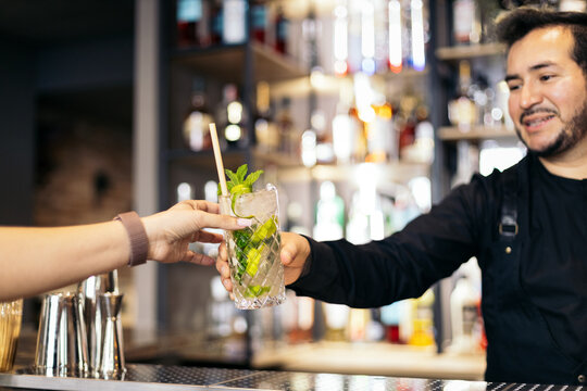 Bartender Serving Cocktail