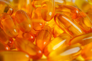Fish oil or Cod liver oil gel in capsules with omega 3 vitamins, supplementary healthy food .
