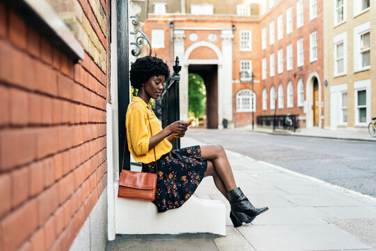 Pretty woman typing cellphone