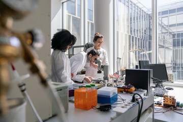 Workers of Biomechanics Lab Using Microscope