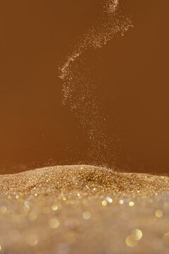 Close up of falling golden sand