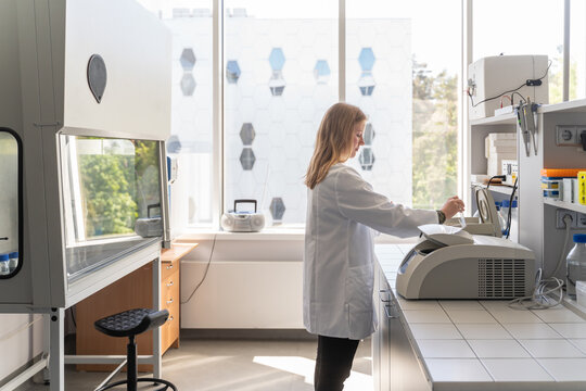 Researcher Using Laboratory Equipment
