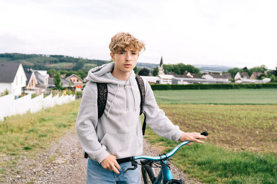 Teenager with a bike outdoor