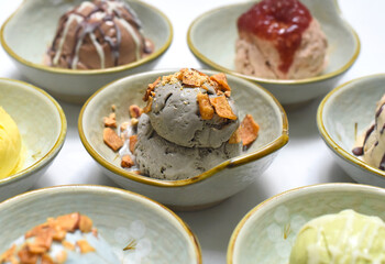 Organic ice cream in ceramic bowls on white background closeup