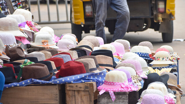 Sale of beach hats for female and male in a beach market of Puri Odisha.