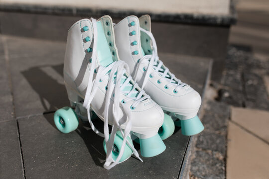 Roller skaters on the street in sunlight