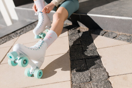 Woman putting on roller skates