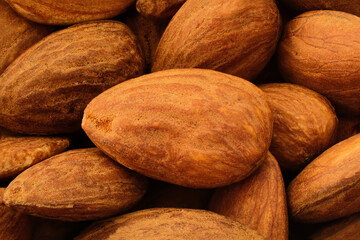 Fresh raw organic almonds in extreme close-up