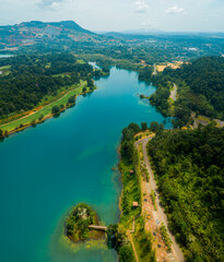 Aerial drone view of lake scenery with turquoise water in Tasik Puteri, Bukit Besi, Terengganu, Malaysia.