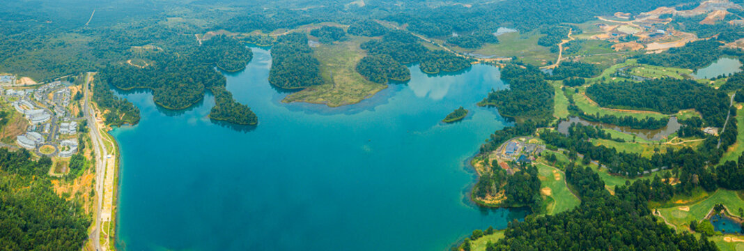 Aerial drone view of lake scenery with turquoise water in Tasik Puteri, Bukit Besi, Terengganu, Malaysia.