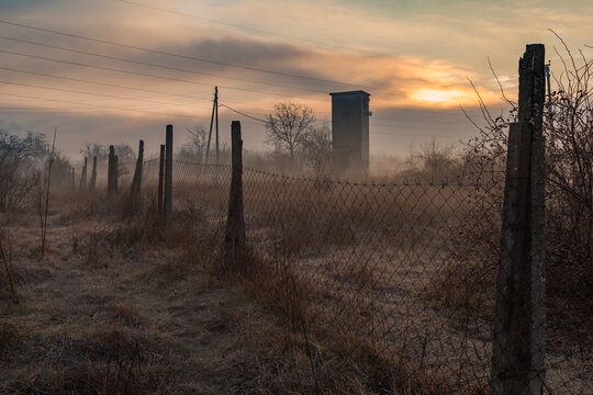 Fogy sunrise on a field 
