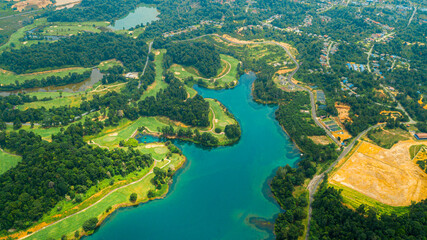Fototapeta premium Aerial drone view of lake scenery with turquoise water in Tasik Puteri, Bukit Besi, Terengganu, Malaysia.