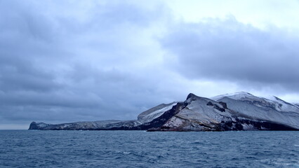 Pass in the snow covered mountains surrounding the crater bay on Deception Island, Antarctica