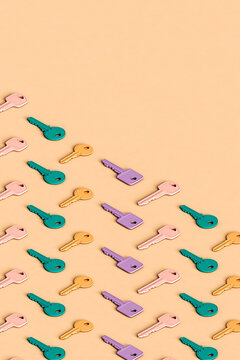 many colorful different keys on a pink background