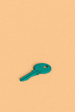 a blue key on a pink background