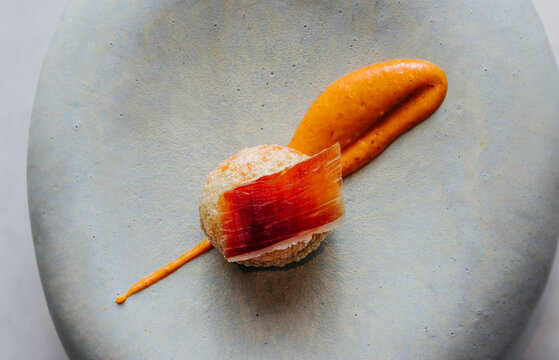 Delicious homemade salmorejo ball with serrano ham