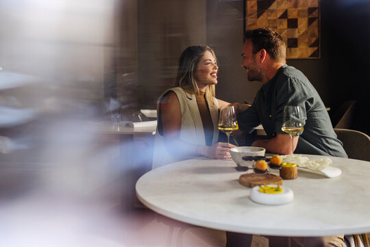 Happy couple having brunch in cafe