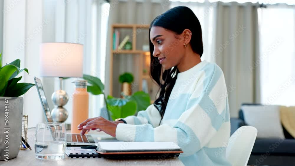 Poster Female student typing and completing an assignment for college on a laptop at home. One Indian girl communicating with a lecturer through email and finishing her schoolwork in the living room