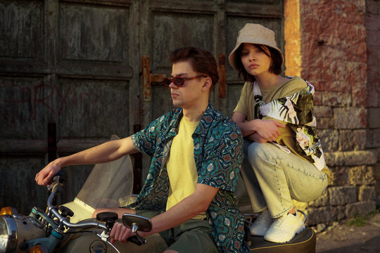 A stylish couple on the vintage motorcycle