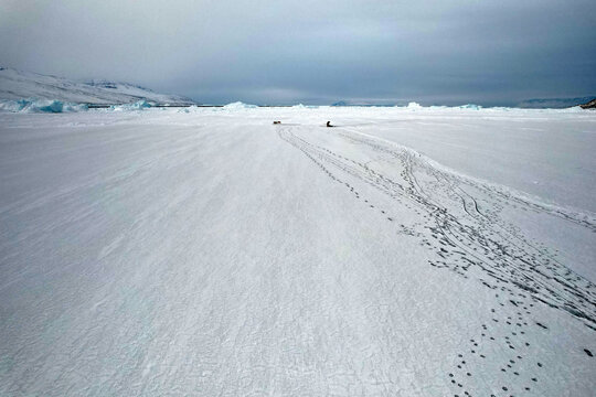 Greenland Inuit Inuk Eskimo, traditional seal hunt on Arctic sea ice