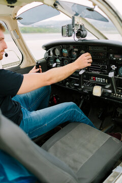 Young pilot cheking the dashbord