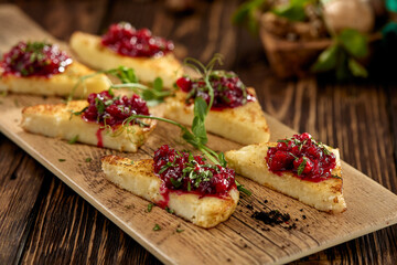 Hot appetizer for wine - grilled halloumi cheese with jam. Cheese appetizer baked halloumi on...