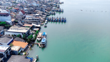 Fototapeta na wymiar Aerial view of fisherman dock which has many ships anchoring for transport seafood and supplies on island of Songkhla, Thailand