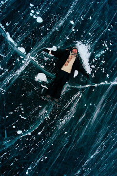 Lying on frozen Arctic lake, anthropogenic climate change Anthropocene