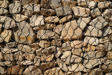 Rocks behind chicken wire