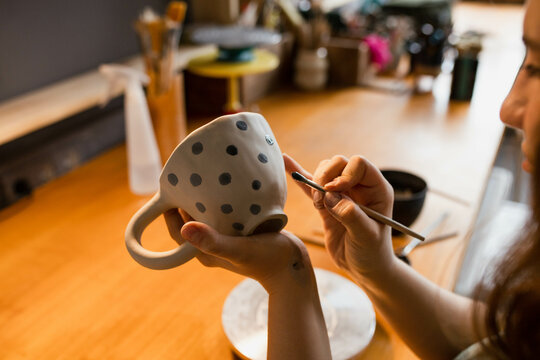 Ceramist at work in her creative workshop