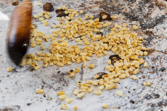Kernels of corn on a comal (griddle) 