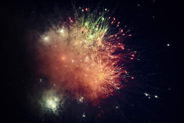 multicolored lights of fireworks exploding in the night sky