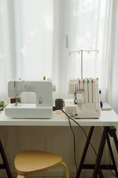 Sewing machines on the table in a home sewing studio
