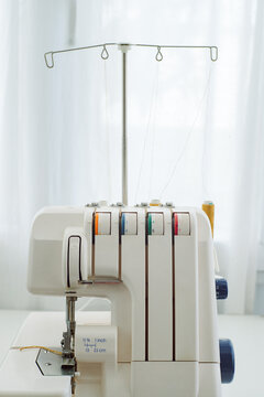 Sewing machines on the table in a home sewing studio