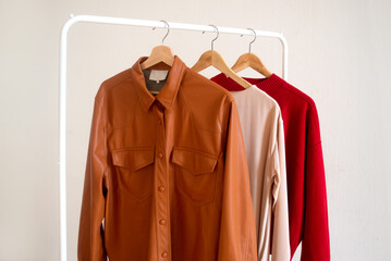 Warm tones clothes hanging on a rail