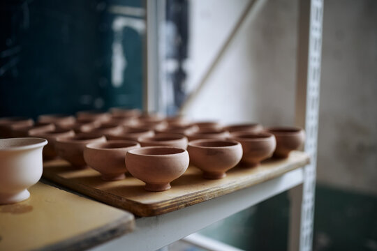 Handmade Ceramic Pottery On A Studio Shelf In Anhui, China.