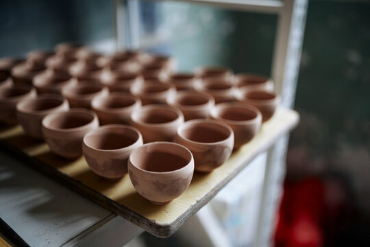 Handmade Ceramic Pottery On A Studio Shelf In Anhui, China.