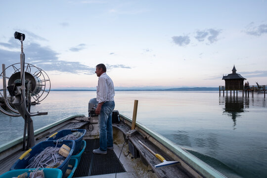 Fisherman casts his net