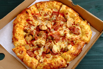 Slice of Pizza with meat topping, close up
