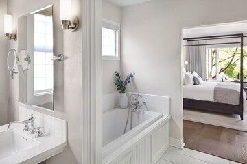 Luxury hotel room and bathroom with bathtub