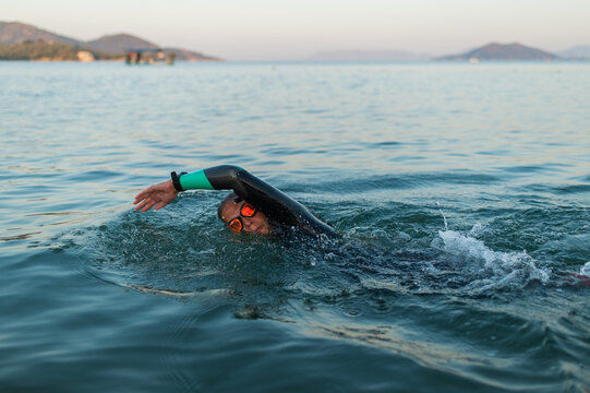 female swimming in the open water - Powered by Adobe
