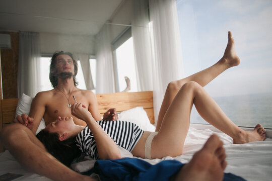 young couple in bed early morning