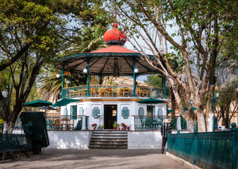 The Kiosk in the gardens of Central plaza or Zocalo in San Cristóbal de las Casas, the historic highland town Mexico -known for its well-preserved colonial architecture. The corners of the kiosk have 