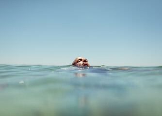 Portrait of a man floating in the water